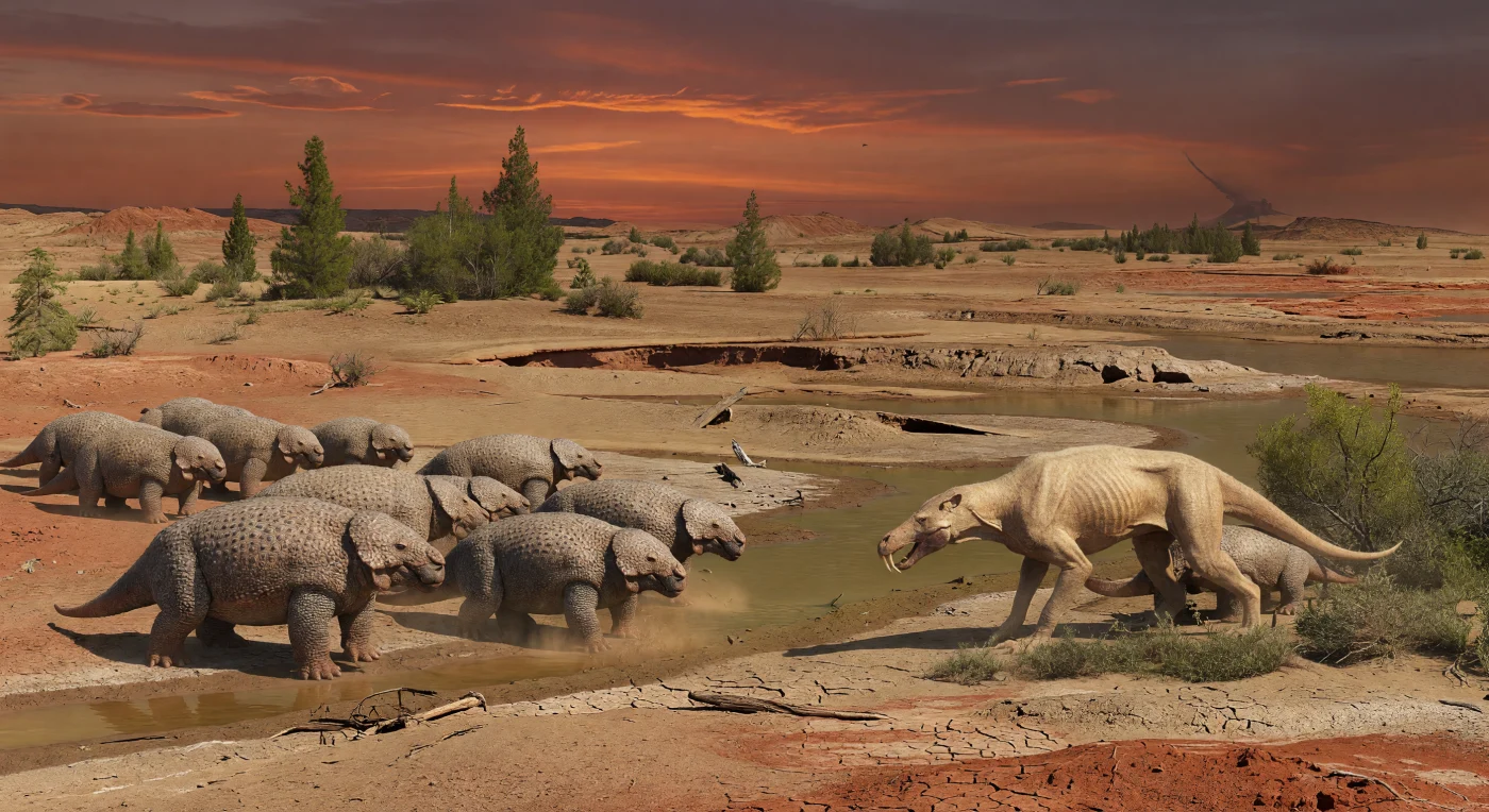 In der kupferfarbenen Abenddämmerung des späten Perms zieht eine kleine Herde von Scutosaurus karpinskii über eine trockene, rissige Schwemmebene, während ein lauernder Inostrancevia mit säbelartigen Eckzähnen aus spärlichem Buschwerk hervortritt. Diese Szene spielt vor etwa 252 Millionen Jahren auf der russischen Plattform im nördlichen Pangaea, wo heiße Treibhausbedingungen, Staub und austrocknende Flutrinnen bereits die Umweltkrise am Ende des Perms ankündigten. Scutosaurus war ein schwer gebauter Pareiasaurier-Pflanzenfresser, Inostrancevia ein schneller gorgonopsischer Räuber – beide gehörten zu den letzten beherrschenden Landtieren unmittelbar vor dem größten Massenaussterben der Erdgeschichte.